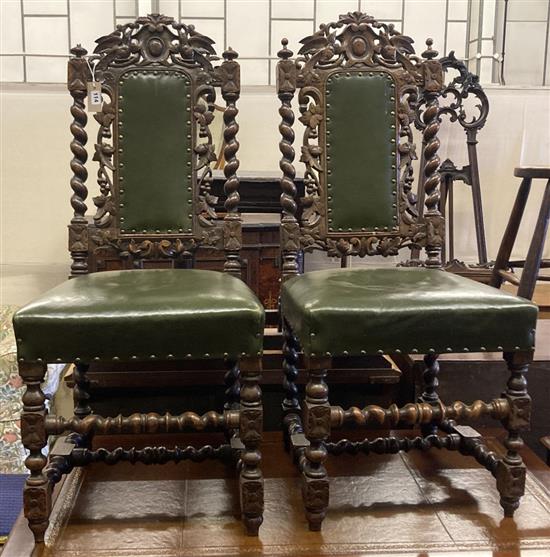 A pair of Victorian carved oak Carolean style side chairs